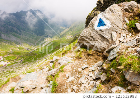steep slope of fagaras ridge. mountain landscape of romania in summer. distant valley in clouds 123512988
