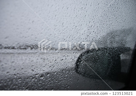 Rainy car window and mirror Rainy car window and mirror 123513021