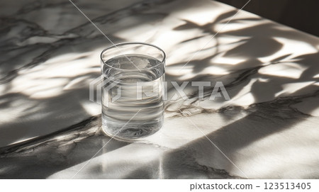Glass of water with soft shadows on marble 123513405