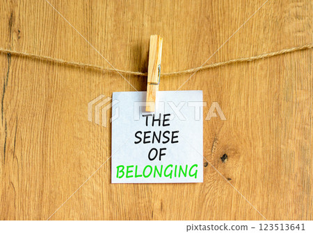 The sense of belonging symbol. Concept words The sense of belonging on beautiful white paper on clothespin. Beautiful wooden background. Business and the sense of belonging concept. Copy space. The sense of belonging symbol. Concept words The sense of belonging on beautiful white paper on clothespin. Beautiful wooden background. Business and the sense of belonging concept. Copy space. 123513641