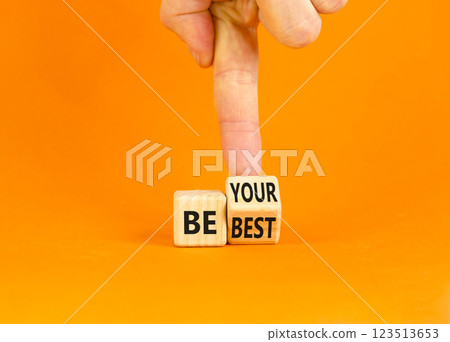 Motivational be your best symbol. Concept words Be your best on beautiful wooden block. Beautiful orange background Businessman hand. Business motivational be your best concept. Copy space. 123513653