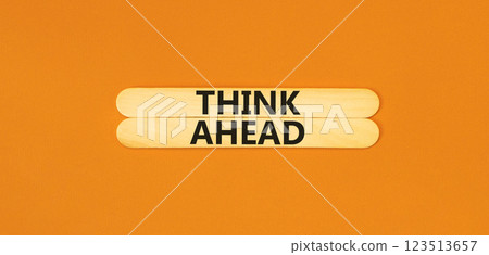 Think ahead symbol. Concept words Think ahead on beautiful wooden stick on a beautiful orange table orange background. Business, support, motivation, psychological and think ahead concept. Copy space. 123513657