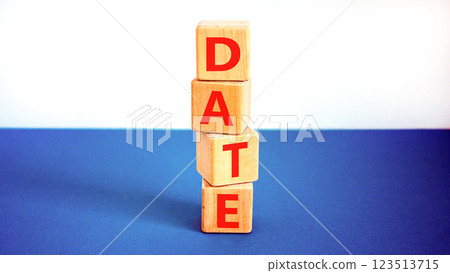 Date symbol. Concept word Date on beautiful wooden blocks. Beautiful white and blue background. Business and date concept. Copy space. 123513715