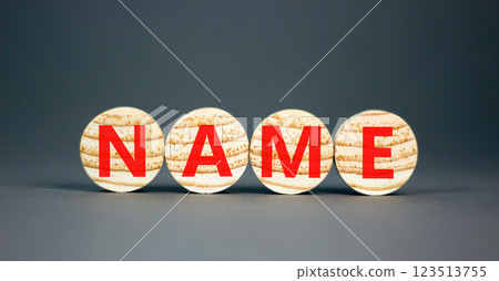 Name symbol. Concept word Name on beautiful wooden circles. Beautiful grey table grey background. Business, lifestyle, support and name concept. Copy space. 123513755