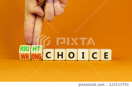 Right or wrong choice symbol. Concept words Right choice or Wrong choice on beautiful wooden blocks. Beautiful orange table orange background. Business right or wrong choice concept. Copy space. 123513791
