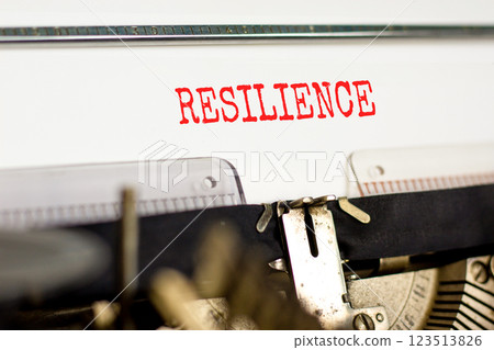 Resilience symbol. Concept word Resilience typed beautiful old retro vintage typewriter. Beautiful white paper background. Business resilience concept. Copy space. 123513826
