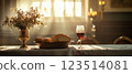 Wine Glass, Bread, and Flowers in Sunlight 123514081