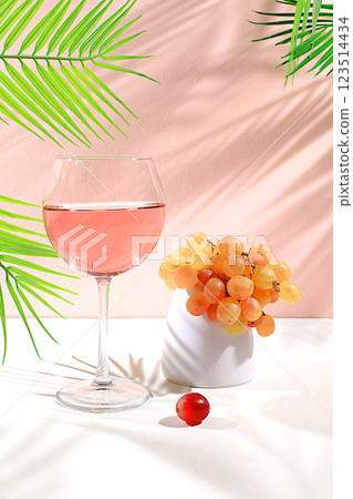 Festive alcoholic cocktail, glasses of white wine on a background with shadows, bar concept, alcoholic drinks at a party, banner for advertising a restaurant or cafe, selective focus 123514434