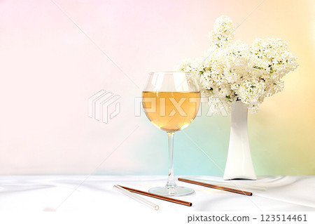 Festive alcoholic cocktail, white wine in a glass on a bright background with a bouquet of white lilacs, summer bar concept, alcoholic drinks at a party, restaurant and cafe advertising, selective Festive alcoholic cocktail, white wine in a glass on a bright background with a bouquet of white lilacs, summer bar concept, alcoholic drinks at a party, restaurant and cafe advertising, selective 123514461