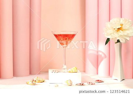 Modern summer still life with pink martini, alcoholic cocktail, seashells and peony flowers on elegant modern background, minimal concept for bar and holiday party, cafe, advertising banner 123514621