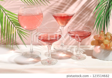 Modern still life with white wine, alcoholic margarita cocktail and grapes on a pastel background with long hard shadows, minimal concept for a bar, cafe, advertising banner, selective focus, space 123514682