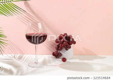 Modern still life with red wine, margarita alcoholic cocktail and grapes on a pastel background with long hard shadows, minimal concept for a bar, cafe, advertising banner, selective focus, space for Modern still life with red wine, margarita alcoholic cocktail and grapes on a pastel background with long hard shadows, minimal concept for a bar, cafe, advertising banner, selective focus, space for 123514684
