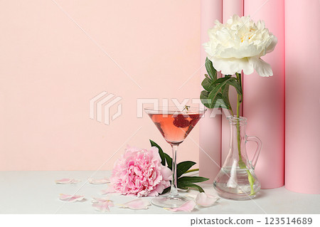 Modern still life with pink martini, alcoholic cocktail and peony flowers on elegant modern background, minimal concept for bar and holiday party, cafe, advertising banner, selective focus, space for Modern still life with pink martini, alcoholic cocktail and peony flowers on elegant modern background, minimal concept for bar and holiday party, cafe, advertising banner, selective focus, space for 123514689