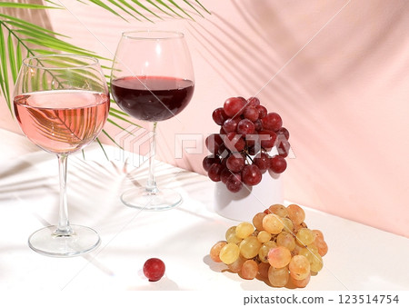 Modern still life with white and red wine, alcoholic margarita cocktail and grapes on pastel background with long hard shadows, minimal concept for bar, cafe, advertising banner, selective focus, 123514754