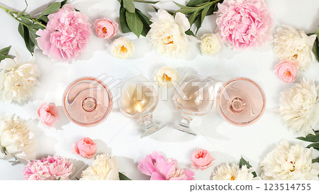 Floral composition with different varieties of rose wine, summer alcoholic cocktail for a party and peony flowers on a light background, the concept of a bar, cafe, advertising banner, selective Floral composition with different varieties of rose wine, summer alcoholic cocktail for a party and peony flowers on a light background, the concept of a bar, cafe, advertising banner, selective 123514755
