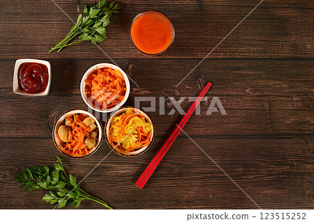 Carrot, cabbage, garlic, parsley and juice on wooden background.Korean kimchi side dish for barbecue dinner, carrot with sauce and hot pepper from fermented food set, detox diet concept.healthy Carrot, cabbage, garlic, parsley and juice on wooden background.Korean kimchi side dish for barbecue dinner, carrot with sauce and hot pepper from fermented food set, detox diet concept.healthy 123515252