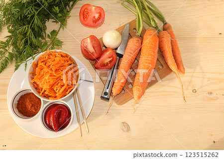 Korean side dish for barbecue dinner, carrots with sauce and hot pepper, A set of fermented foods that are good for intestinal health, carrots, cabbage, garlic, kimchi. top view of glass bowls on Korean side dish for barbecue dinner, carrots with sauce and hot pepper, A set of fermented foods that are good for intestinal health, carrots, cabbage, garlic, kimchi. top view of glass bowls on 123515262