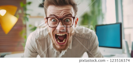 Frustrated man in office setting Frustrated man in office setting 123516374