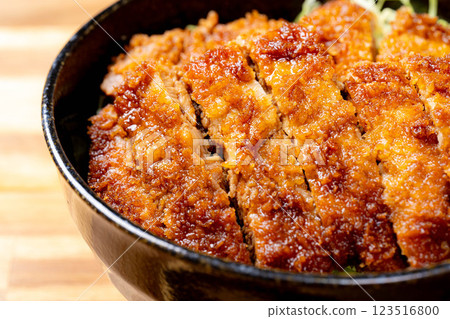 [Food ingredients] Sauce katsudon served in a bowl [Local cuisine] 123516800