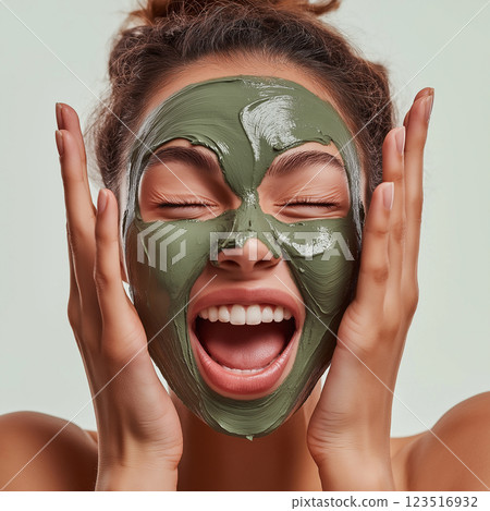 Skincare facial for a glowing, happy look with a green beauty relaxation mask treatment 123516932