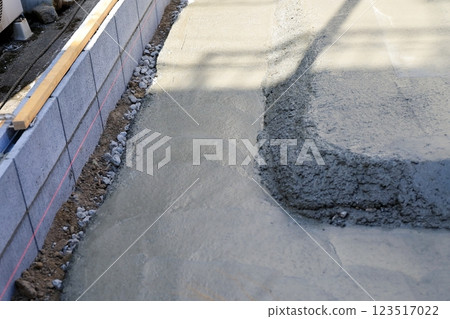 Residential foundation work: Waste concrete after pouring Residential foundation work: Waste concrete after pouring 123517022