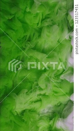 Wave paint art. Water ink surface. Defocused green white color haze cloud smoke liquid fume vapor flow on abstract light background. 123517451