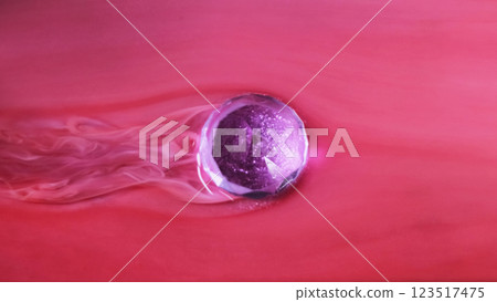 Floating christmas ball. Wet paint. Defocused purple red color glitter glow globe smooth wave ink texture on abstract art background. Floating christmas ball. Wet paint. Defocused purple red color glitter glow globe smooth wave ink texture on abstract art background. 123517475