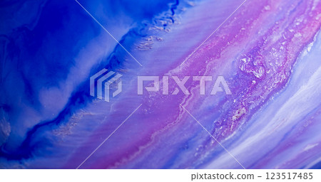 Marble flow. Sparkling ink. Defocused pink blue purple color shiny dust polish particles liquid pigment leak blend abstract background. Marble flow. Sparkling ink. Defocused pink blue purple color shiny dust polish particles liquid pigment leak blend abstract background. 123517485