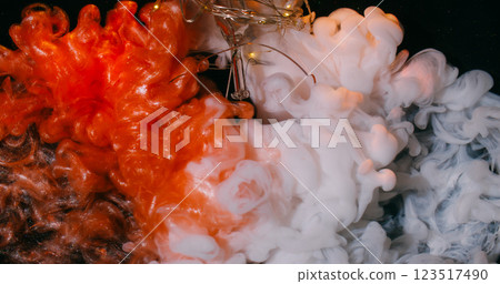 Paint flow. Shimmering fume. Clash white copper orange fog spray shiny particles mixing dark water abstract background with broken glass garland. 123517490
