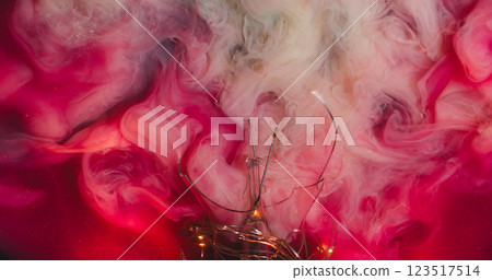 Bright fume. Paint smoke. Exploding red pink cloud ink into white art liquid mix veil background. Fluids texture broken glass garland lights. 123517514