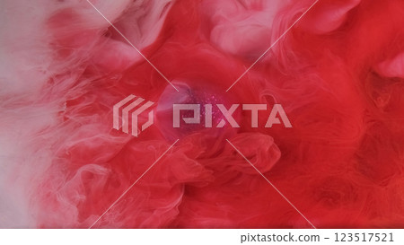 Ink water. Fluid mix. Defocused red white multicolor haze cloud vapor sparkle paint flow glitter purple Christmas ball on abstract art background. 123517521