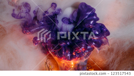 Paint burst. Glitter cloud. Purple bright stream emerges from broken glass light bulb illuminated by garland foggy shimmering white abstract background. Paint burst. Glitter cloud. Purple bright stream emerges from broken glass light bulb illuminated by garland foggy shimmering white abstract background. 123517543