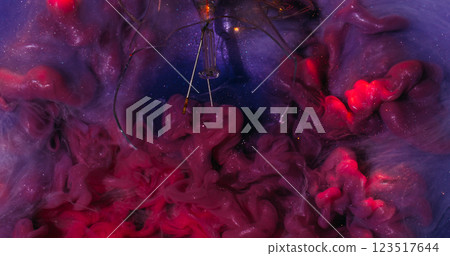 Particles paint. Smoky flow. Shimmering hypnotic pink purple current wavy mixing in sparkling water. Cloudy smooth color stream background. Particles paint. Smoky flow. Shimmering hypnotic pink purple current wavy mixing in sparkling water. Cloudy smooth color stream background. 123517644