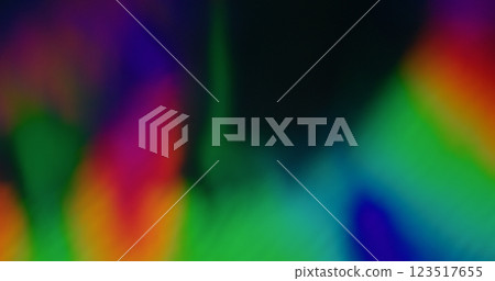 Abstract futuristic background. Blurred shiny overlay. Defocused leak multicolor green orange rays rainbow gradient flickers beam lens flare on art black dark. Abstract futuristic background. Blurred shiny overlay. Defocused leak multicolor green orange rays rainbow gradient flickers beam lens flare on art black dark. 123517655