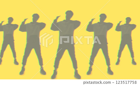 Dancer pattern. Choreography design. Defocused mirrored double exposure silhouette of guy performing contemporary movements isolated on yellow. Dancer pattern. Choreography design. Defocused mirrored double exposure silhouette of guy performing contemporary movements isolated on yellow. 123517758