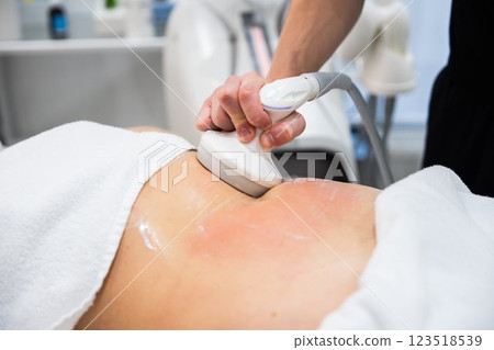 Professional body treatment in a modern wellness center during a session 123518539