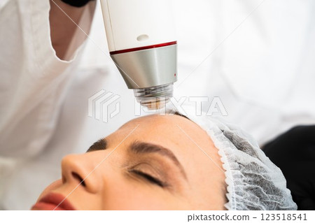 Skincare treatment session using high-tech device for rejuvenation 123518541