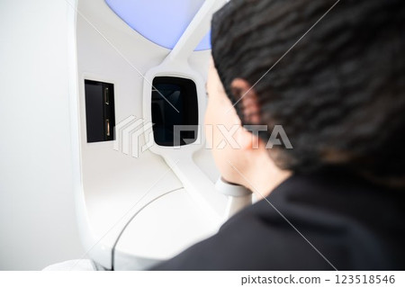 Person interacting with advanced technology in a modern setting 123518546
