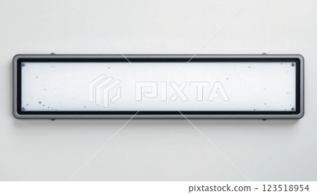 A rectangular, gray-framed sign featuring a smooth white surface, suitable for displaying information or directions in office spaces, schools, or public buildings. 123518954