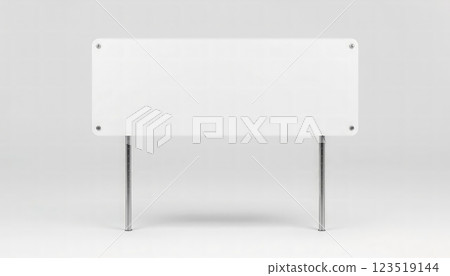 A blank white sign on metal legs stands ready for messages, ideal for advertising, promotions, or events, offering a versatile presentation option. 123519144