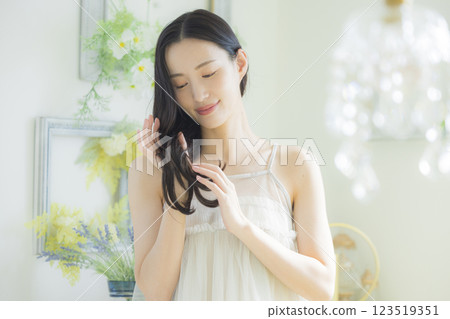 Young woman, hair care image 123519351