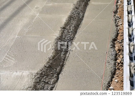 Residential foundation work: Waste concrete after pouring 123519869