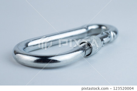 High-quality stainless steel carabiner on light background 123520004