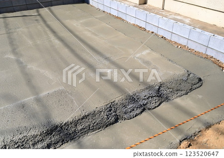 Residential foundation work: Waste concrete after pouring 123520647