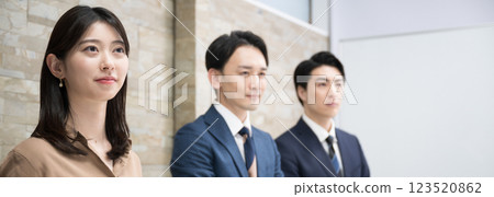 Side-by-side profile of a team of men and women working in an office, looking to the future and hope, aiming for a goal 123520862