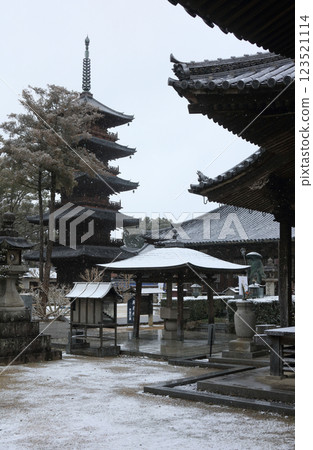 View of the Daishido, main hall, and five-story pagoda from the side of the main gate at the snowy 70th temple of the Shikoku Pilgrimage, Honzan-ji Temple View of the Daishido, main hall, and five-story pagoda from the side of the main gate at the snowy 70th temple of the Shikoku Pilgrimage, Honzan-ji Temple 123521114