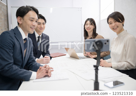 A business scene with multiple teams distributing YouTube videos, meetings, seminars online, etc. 123521310