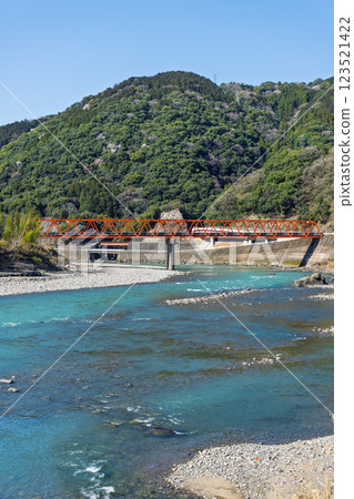 Spring weather: The Kuma River landscape with the natural mountain ranges in the background (Kuma Village, Kuma District) Spring weather: The Kuma River landscape with the natural mountain ranges in the background (Kuma Village, Kuma District) 123521422