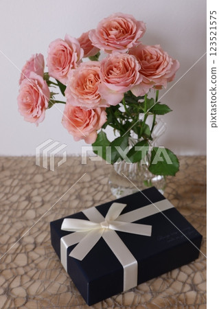 Rose flower and present Rose flower and present 123521575