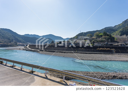 Spring weather: The Kuma River landscape with the natural mountain ranges in the background (Kuma Village, Kuma District) Spring weather: The Kuma River landscape with the natural mountain ranges in the background (Kuma Village, Kuma District) 123521628